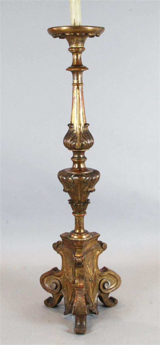 A North Italian giltwood floor standing altar candlestick, H.4ft 10.5in.